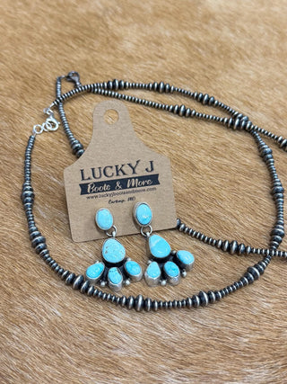 Ella Peter jewelry, Turquoise sterling silver earrings, Southwestern post earrings, artisan turquoise jewelry, stamped silver earrings, handmade turquoise studs, Western fashion accessories.