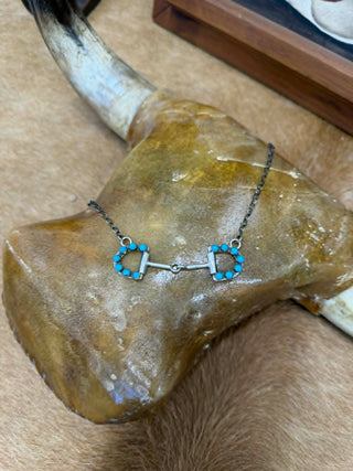 Necklace with turquoise stones on a steer head