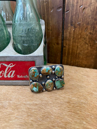 Turquoise belt buckles, sterling silver buckles, Bobby Johnson jewelry, Travis J turquoise, authentic turquoise, handcrafted western buckles, artisan sterling silver, Navajo style jewelry.